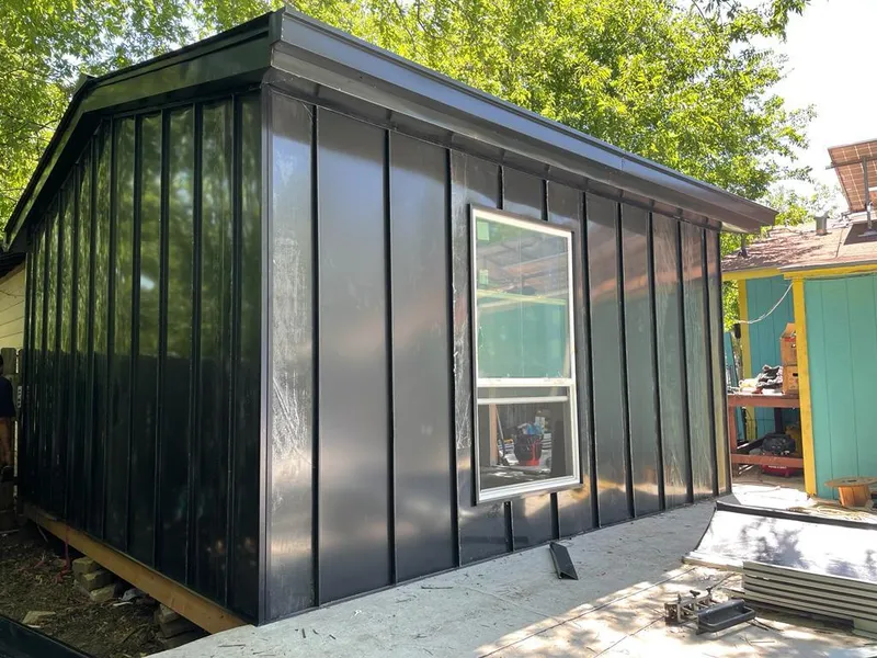 Black standing seam metal wall panels for Roof Inspection in Woodruff